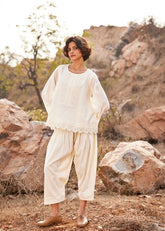 A Model Wearing White Cotton Mul Shuchi Salwar Pants,curated by Only Ethikal